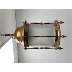 Large brass ceiling hallway lantern, cylinder form with domed top supported by a series of turned spindles on circular moulded base, opaque glass inner, three branch light, H60cm (excluding hook fixture), D40cm