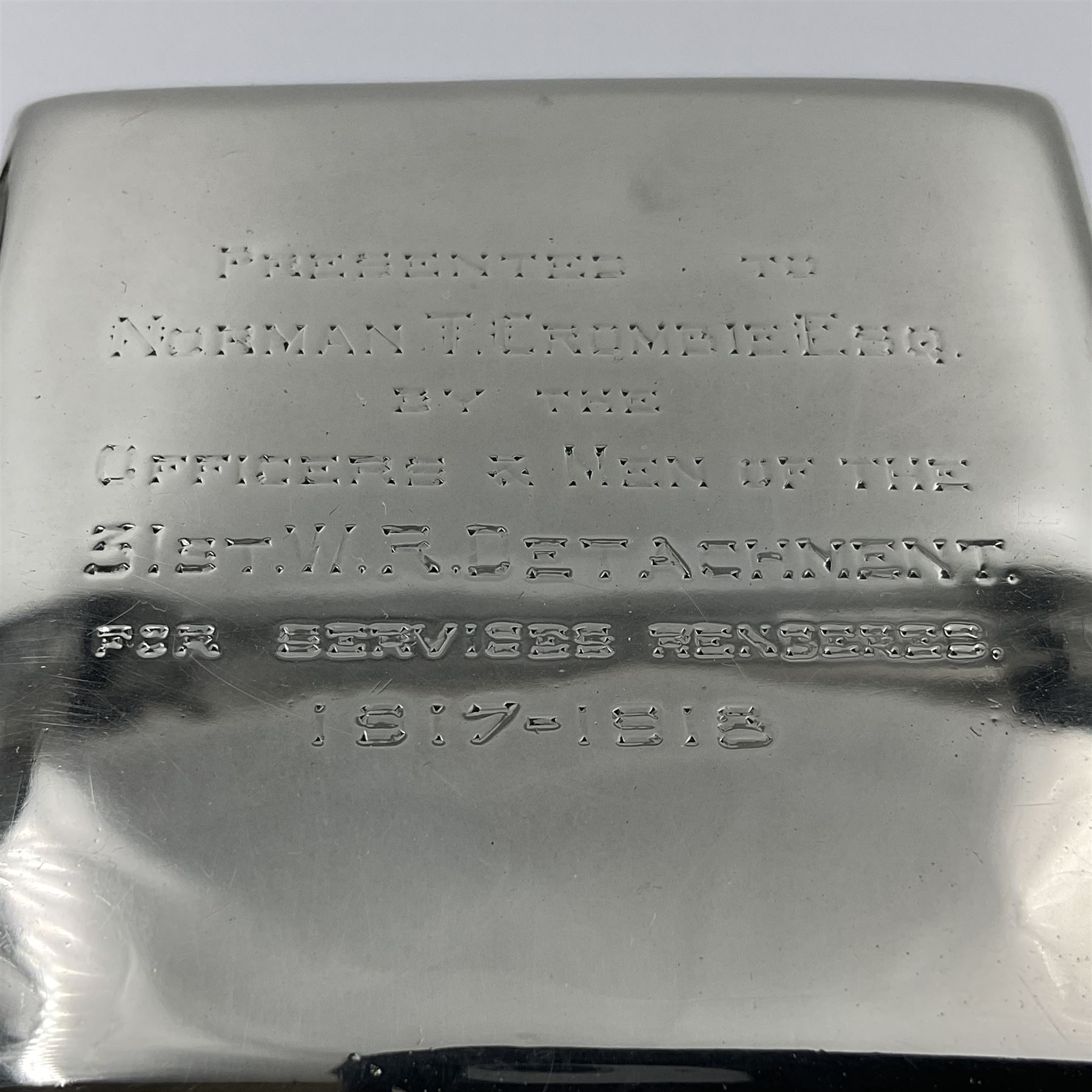 Edwardian silver mounted playing card case, hallmarked William Harrison Walter, Birmingham 1903, the sides each with a period playing card set behind a bevelled glass panel, the hinged cover with later engraving 'Presented to Norman T Crombie Esq by the officers & men of the 31st WR Detachment for services rendered 1917-1918', with red leather lined interior, the three compartments upon a sprung base and containing two later wooden Whist markers, case H12.5cm