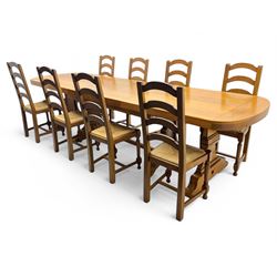 Oak extending dining table with elegant scrolled shaped double pedestal base and scrolled ...