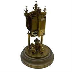 A 20th century rotary pendulum torsion clock under a glass dome with a 400-day movement and rotary four-ball pendulum, mounted on a circular brass base with two pillars, steel spade hands, painted steel dial with Arabic hours and minute track, decorated with garlands of flowers, 


