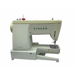 Two Singer sewing machines, model numbers 527 and 457, together with various Singer sewing machine parts, and a selection of sewing related accessories, to include threads, sewing needles, etc. 