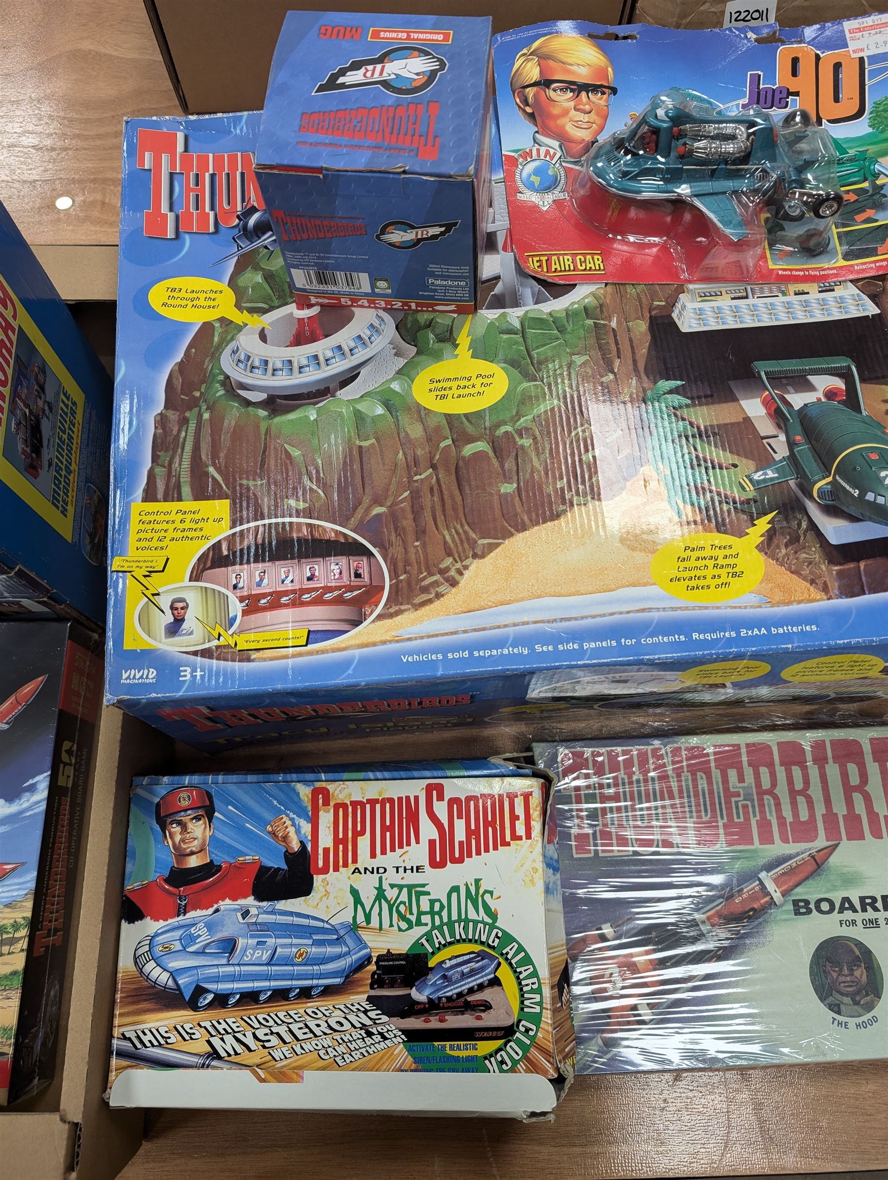 Gerry Anderson interest collectables and toys, including Carlton Thunderbirds Tracy Island, Matchbox Stingray Marineville Headquarters, both boxed, Matchbox carded Thunderbirds and Stingray figures and vehicles, Captain Scarlet and Joe90 collectables, etc