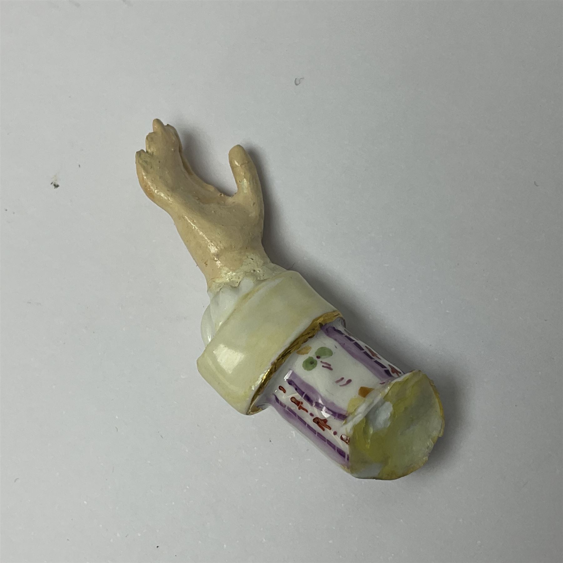 Pair of late 19th/early 20th Century Meissen figures, modelled as flower sellers, after the original by Michel Victor Acier, she holding basket of flowers, he holding flowers in his hat, each with underglaze cross swords mark beneath, tallest H16.5cm