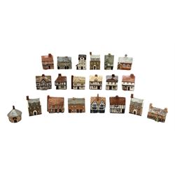 Twenty studio pottery figures of houses and cottages, comprising seventeen Mudlen End Studio Felsham Suffolk examples and two John Putman's Heritage Houses examples