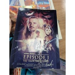 Collection of Star Trek The Next Generation and Deep Space Nine memorabilia, including two limited edition signed Star Trek Deep Space Nine photographs, commemorative porcelain plaque, insignias, Encounter at Farpoint pewter plaque, signed photograph of the Voyager crew, two signed copies of Convergence and a signed War & Madness graphic novel, canvas prints and other signed photos, together with Star Wars Ray Park (Darth Maul) signed photograph, UFO and Buck Rogers memorabilia