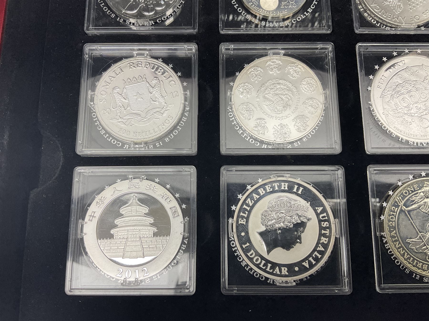 'The 2012 Fabulous 12 Silver Coin Collection' including Queen Elizabeth II Britannia one ounce silver two pound coin, Queen Elizabeth II Canada Maple Leaf one ounce silver five dollar coin, Queen Elizabeth II Australian Koala one ounce silver one dollar coin, Austrian Philharmonic one and a half euro coin, etc., in wooden presentation case