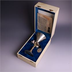Modern limited edition silver goblet, 'made by order the provost and charter of Blackburn to commemorate the fiftieth anniversary of the cathedral in 1976 and its consecration in 1977' designed by Hector Miller for Aurum, the plain fluted cup, upon a stem of three lillies with parcel gilt highlihts and upon a circular foot, no. 2/750, hallmarked Hector Miller, London 1977, H17cm, boxed with certificate of authenticity