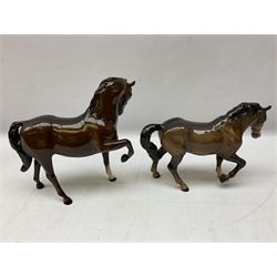 Five Beswick horse figures, comprising bay Hackney pony no. H261, bay stocky jogging mare no.1090, bay horse no.1549, and two Prancing Arabs in bay and palomino no. 1261, all with printed mark beneath 