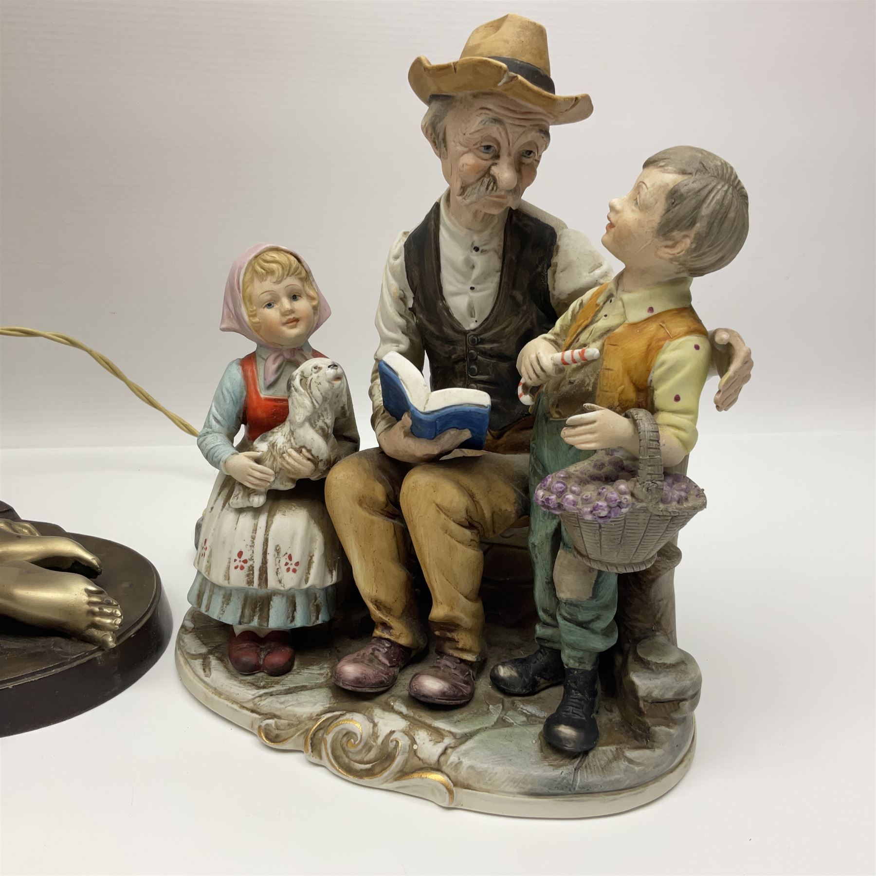 Art Deco style bronzed and gilded spelter figural table lamp with green Uranium glass shade; H48cm, another table lamp; and a bisque group