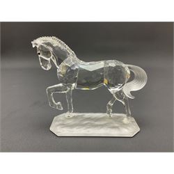 Five Swarovski Crystal horses, comprising stallion, rearing horse, pair of horses playing and Arabian stallion, each with frosted manes and tails, together with a small Swarovski Crystal galloping horse, the mane, tail and base with smoky tint