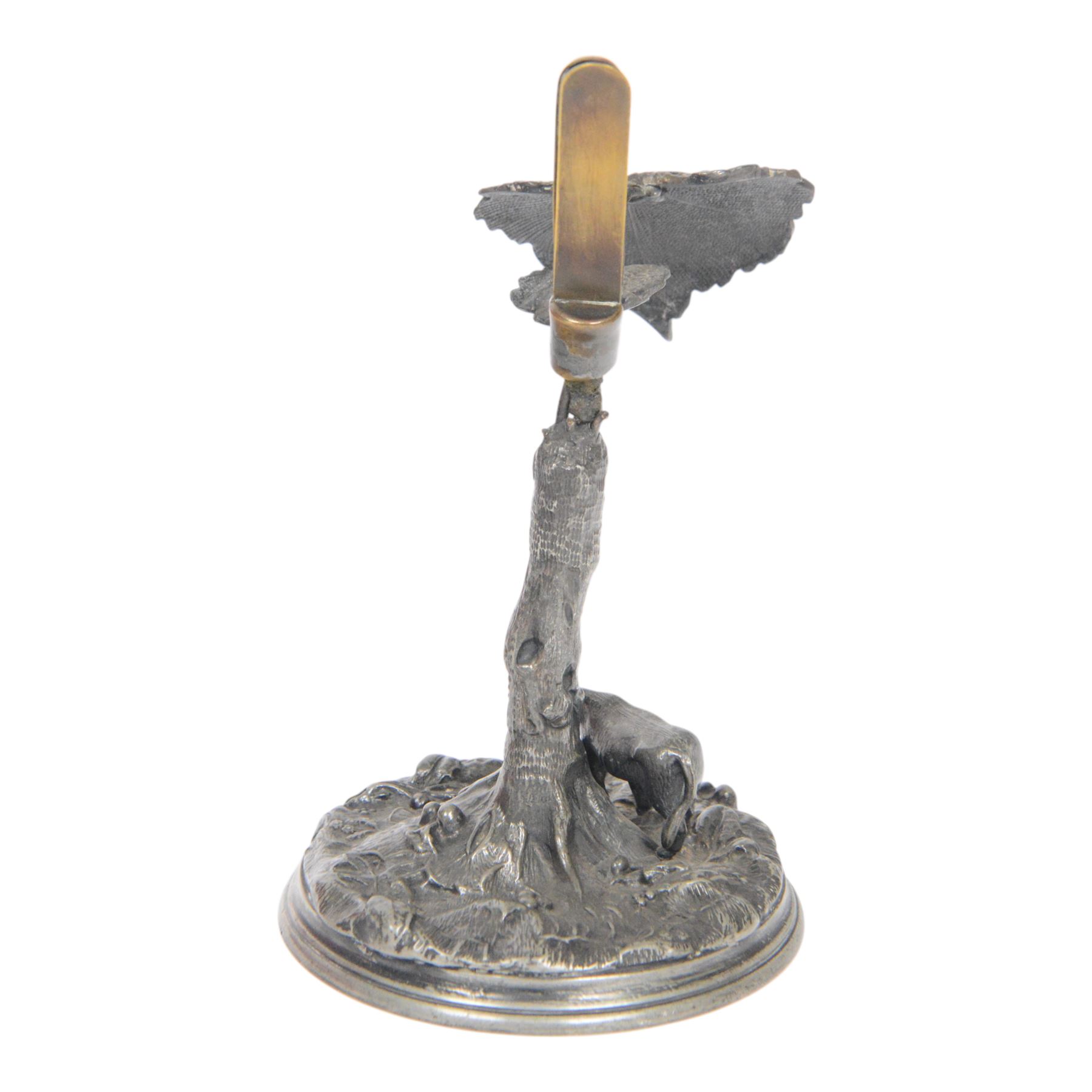 19th century silver plated desk holder, the circular naturalistically modelled base cast with fruiting vines and with applied figure of a ram, rising to a vine with two leaves, and initialled brass clip, H18cm