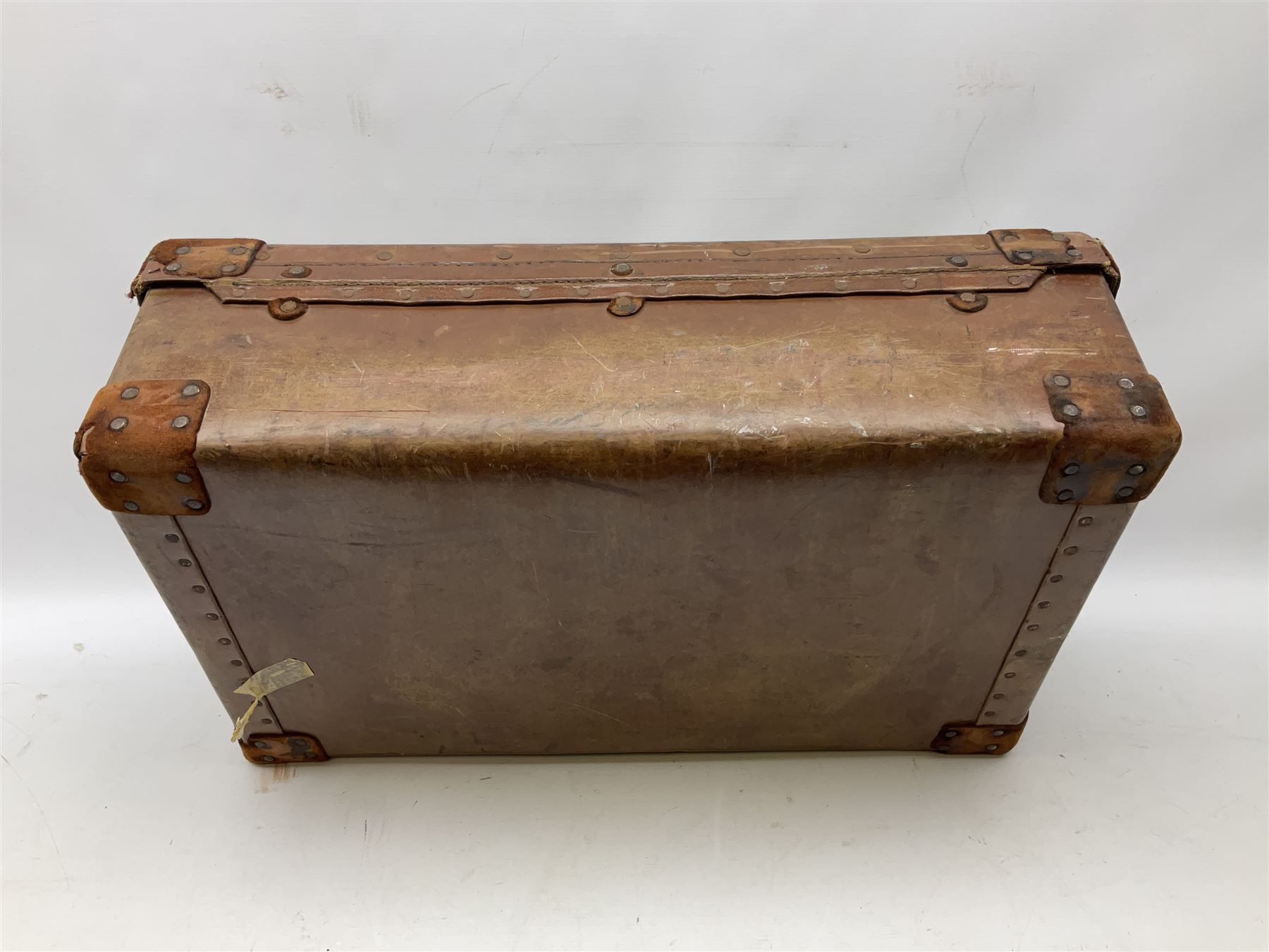 Vintage leather suitcase, by H. J. Cave and Sons of London, with two button slide locks to front, leather handles, reinforced leather corners, manufacturer's label to interiors, L64cm