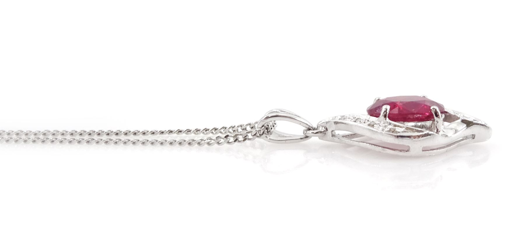 
18ct white gold ruby and diamond pendant necklace, single oval cut ruby of approx 2.50 carat, with single cut diamond surround, on a flattened curb link chain necklace