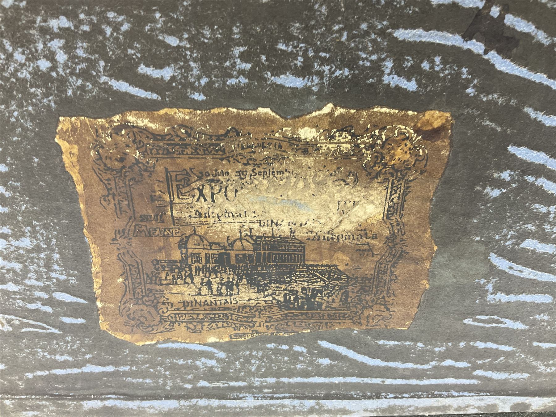 Modern reproduction automaton in the form of a baby doll in a basket clothed in Victorian style lace bloomers and frilled bonnet; clockwork action; on raised platform; with French paper label on base, 29cm wide,