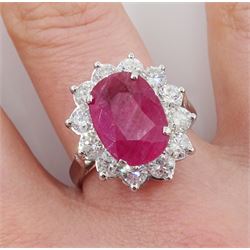 18ct white gold oval ruby and round brilliant cut diamond cluster ring, stamped 18K, ruby approx 3.70 carat, total diamond weight approx 1.65 carat