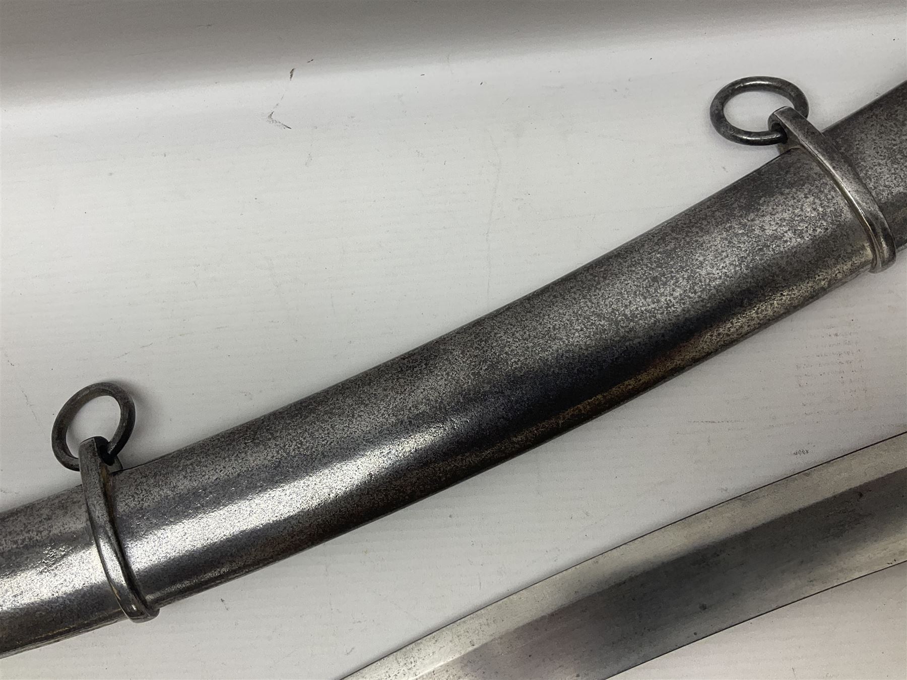 British 1796 Pattern Light Cavalry trooper's sword, the 84cm curving fullered blade stamped Hadley.1 to the back edge, steel hilt with knucklebow, D-shaped langets and leather grip; in polished steel scabbard stamped Osborn & Gunby Birmm. and W.R.16 ( ?16th Light Dragoons) with two suspension rings L100cm overall