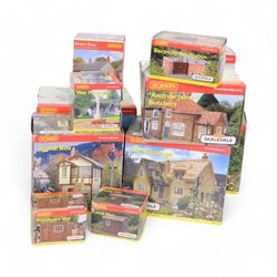 Eleven Hornby '00' gauge Skaledale buildings, comprising R9771 Three Barrels Wine Bar, R8534 Signal Box, R8747 Electricity Sub Station, R8585 Lamp Hut, R8586 Platelayers Hut, R8575 War Memorial, R9828 Bakers Shop, R9767 Andrew James Butchers, R8504 Holly Farm Cottages, R8566 The Boar's Head and R8513 The Vicarige, all boxed