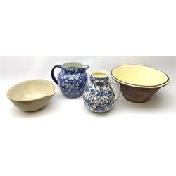 A Victorian terracotta bread pancheon, D43cm H20cm, together with a mixing bowl, and two large jugs, the first Victoria Ware blue and white example decorated in prunus blossom, H25.5cm, the second blue and white example also decorated with a foliate design. 
