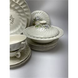 Royal Doulton dinner wares decorated in the Sutherland pattern, comprising two serving platters, one tureen and cover, six twin handled soup bowls and saucers, eight bowls, six dinner plates, seven side plates, and jug. 