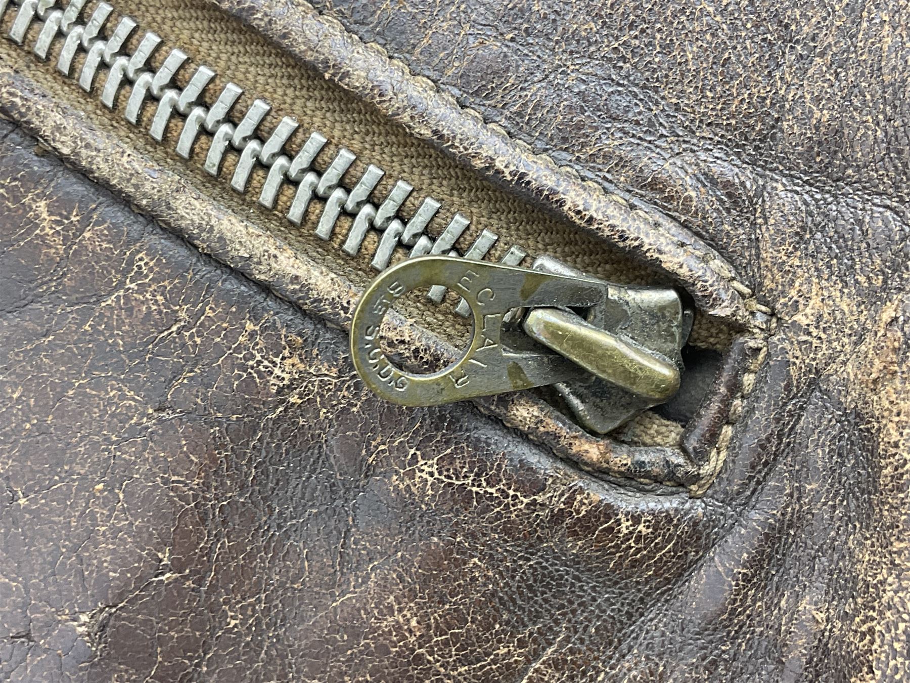 German Luftwaffe Hartmann leather jacket with tartan pocket linings, pocket zip pulls marked 'Eclair Bte.S.G.D.G.'