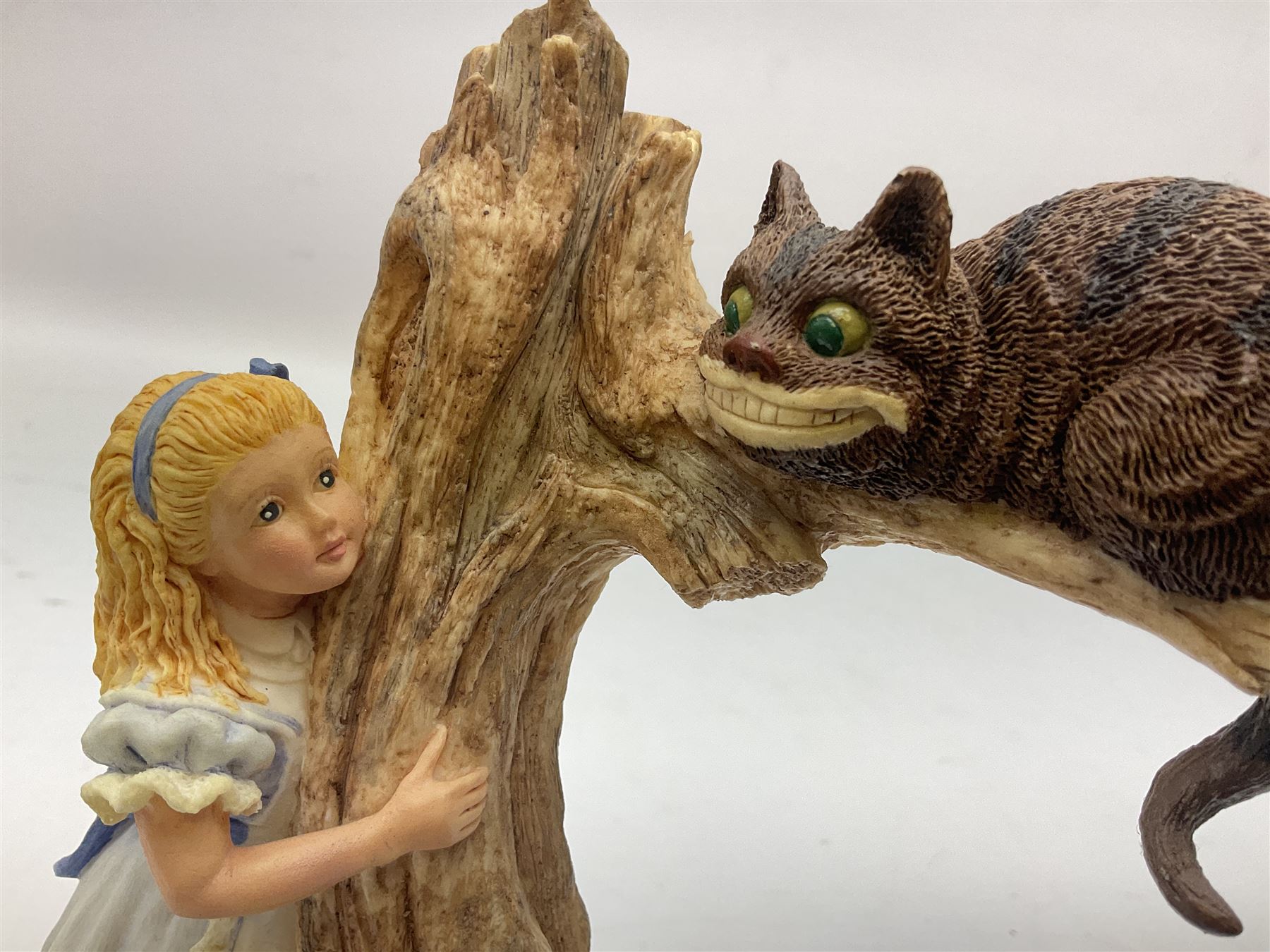 Goebel Alice in Wonderland figures, comprising Alice and Cat, White Rabbit, Queen of Hearts, March Hare, Tweedle Dee and the Mock Turtle, largest H18cm