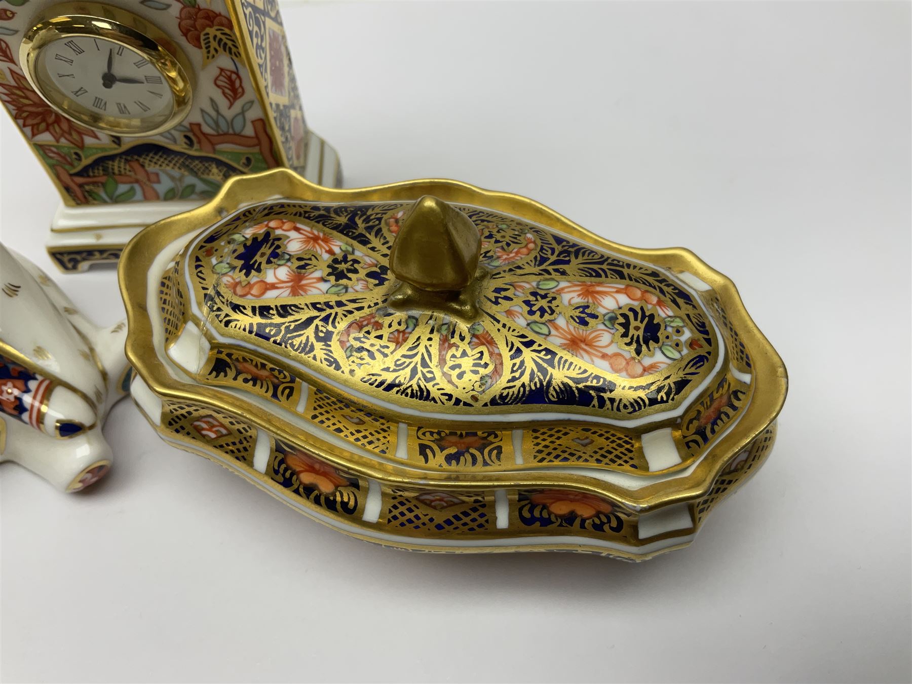 Royal Crown Derby Haiku pattern miniature clock, together with 1128 Imari pattern trinket box with cover and teddy bear figure, all with printed marks beneath   