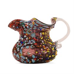 Two Murano Glass jugs by Zecchin, the fist decorated with millefiori design, upon a purple mottled ground, the other upon a green ground, H10cm