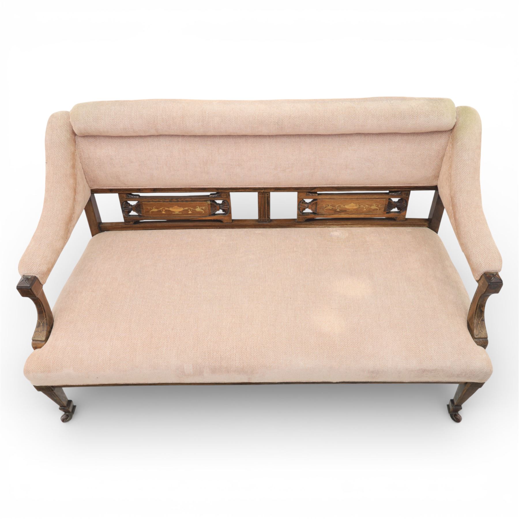 Quality Edwardian seven piece inlaid salon suite, comprising three seater settee, pair of arm chairs and four chairs with pierced splat backs, upholstered in pale pink fabric, inlaid with flowering urns, upon tapering legs with spade feet and castors