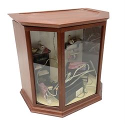 Scratch-built illuminated mahogany doll's house type bow-fronted display of a seamstress's workroom with lift-off top, containing treadle sewing machine, worktable, shelf unit and tailor's dummy etc; L33cm H30cm D21cm