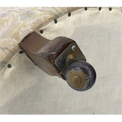 Victorian walnut framed nursing chair, upholstered in buttoned floral pattern fabric, on turned front feet 