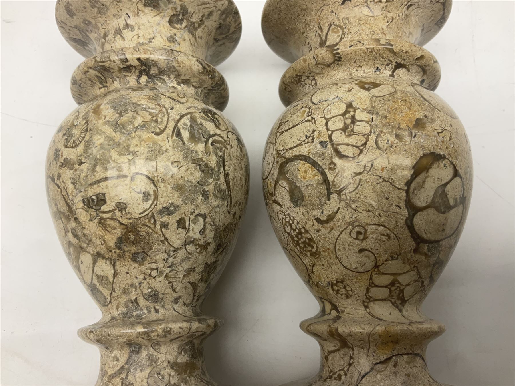 Pair of vases, of baluster form upon a stepped foot, with shell inclusions within the limestone, H15cm  