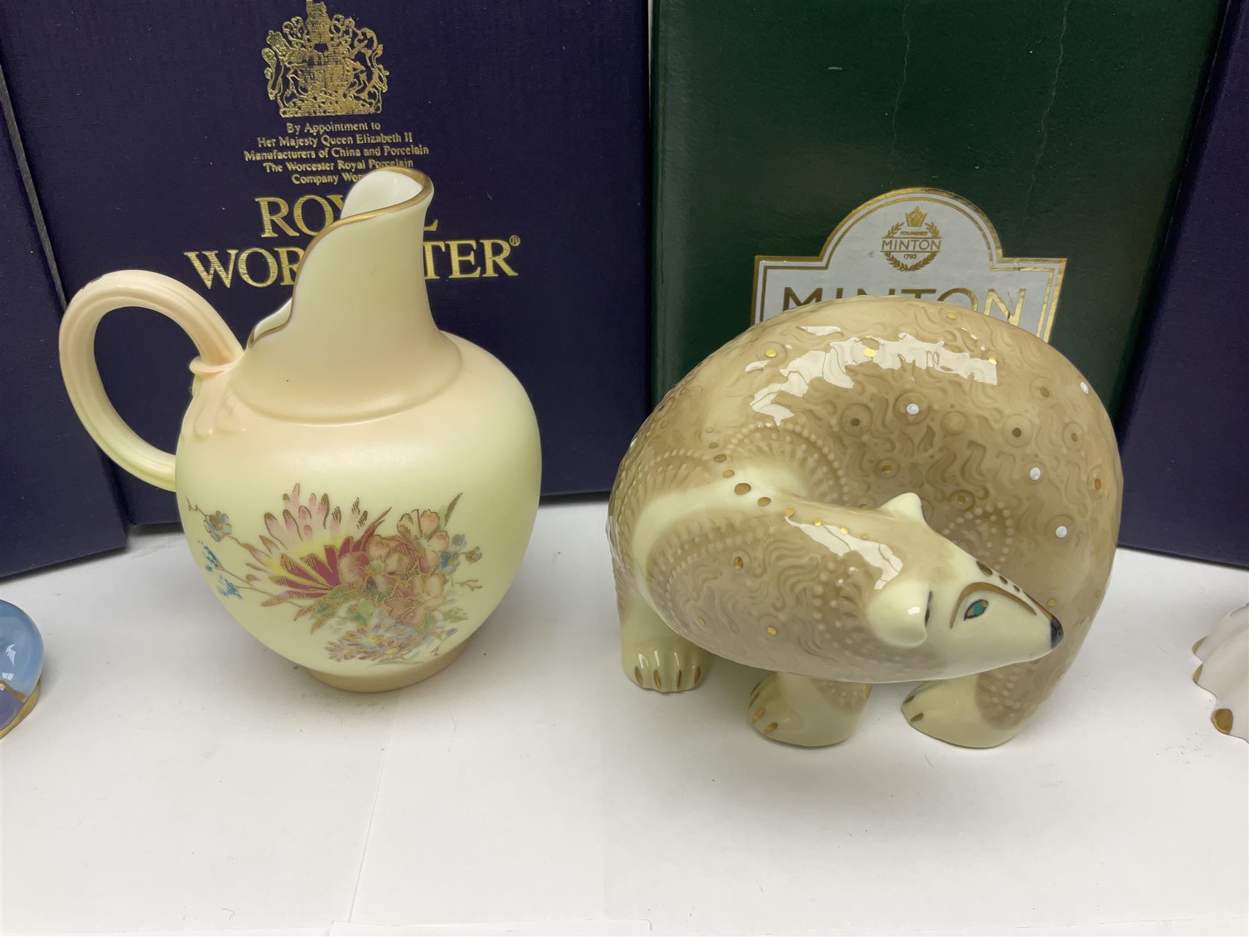 Two Royal Worcester candle snuffers from the connoisseur collection, comprising of Baby and Toby, together with Minton Fawn on Ivory Polar Bear and one other, all with original boxes 