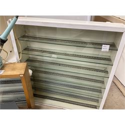 Six shelved cabinets for displaying ‘00’ gauge locomotives comprising plain plywood and white painted examples with track applied to various shelves, largest H63cm, W107cm, D27cm; Collection of tools for building model locomotives to include Weller PU-2D Soldering Pencil and Standard Tip Soldering Iron 20W/230V, Humbrol Modellers Airbrush, Power Supply Units and two wooden chests one of which housing a collection of tools including tweezers, scalping tools, wrenches etc 