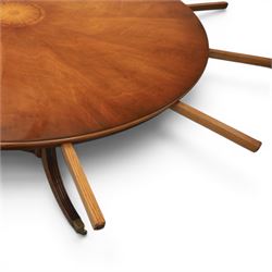 Bevan Funnell Reprodux - Regency design mahogany extending dining table, circular radial veneered top with central fan inlaid patera, on turned pedestal with four reeded downswept supports terminating in brass caps and castors, with six addtional leaves in a fitted storage case