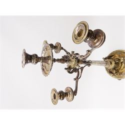 A large Victorian Thomas Bradbury & Sons silver plated candelabrum, the circular base with flower head border upon three domed feet, supporting a central knopped and fluted column flanked by three zoomorphic creatures, leading to a central socket with removable nozzle above a large palmette detailed drip pan, and three scrolling branches with conforming sockets and nozzles, with maker's silver plate mark and Victorian registration lozenge beneath, H62.5cm