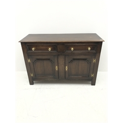 Early 20th century Georgian style oak dresser base, two cupboards with fielded panels and  two drawers above, W137cm, H92cm, D51cm