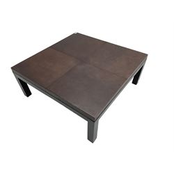 Modern square coffee table, leather top raised on black painted square supports