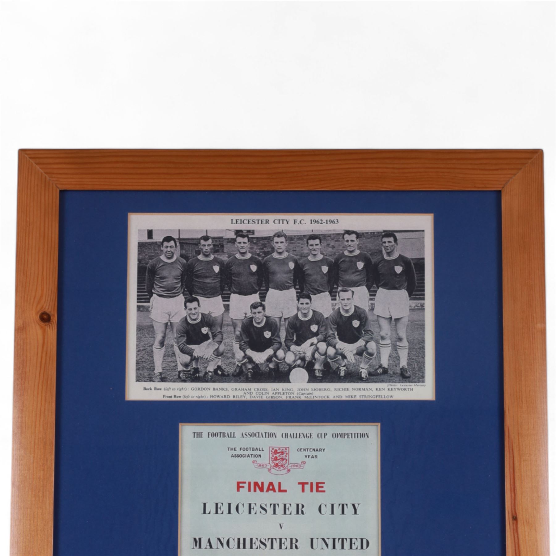F.A. Cup Final Wembley 1963 Leicester City V Manchester United match programme, displayed in a wooden glazed frame with a black and white photograph of the 1962-63 Leicester City team and the team line up and player profiles pages from the programme, frame H73cm

Notes: The 1963 F.A. Cup final was played on 25 May 1963 at Wembley 'Empire' Stadium. The final was won by Manchester United 3-1. 