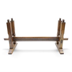 Rupert Griffiths for Monastic Woodcraft - oak 6ft refectory dining table with set six (4+2) matching chairs, rectangular top with arcaded frieze, with trestle base with further arcaded carved stretchers, chairs with carved rails and finials, leather wrapped seats with stud detail, turned supports united by carved stretcher