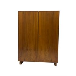 Mid-20th century walnut 'Magic Box' design metamorphic desk cabinet, two doors open to reveal sliding desk with drop leaves, document divisions and internal lamp, on sledge supports 