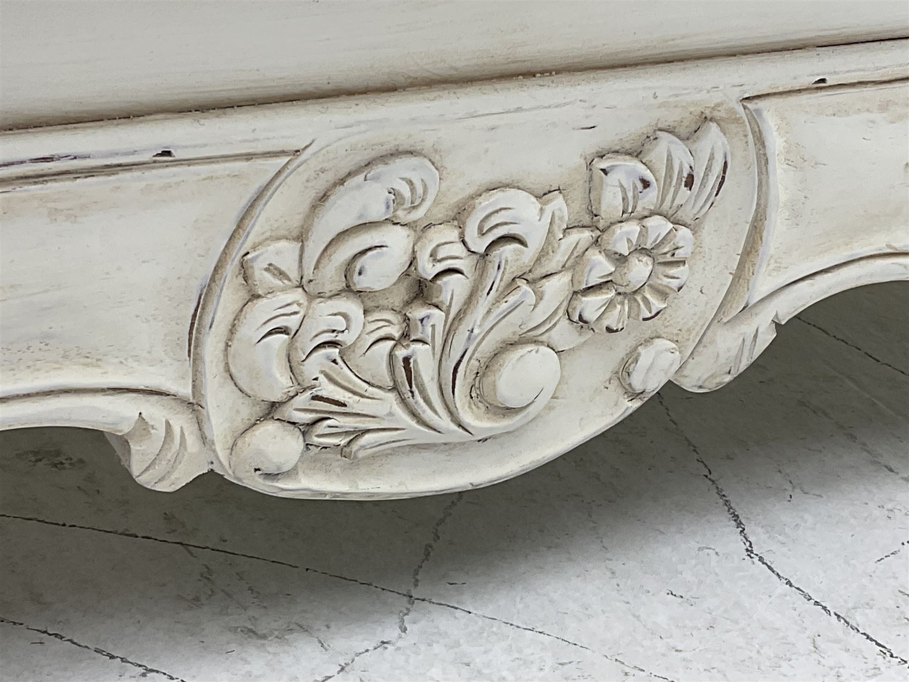 French design bombe shaped chest, moulded rectangular top over two short and three long drawers, on scrolled feet, in cream paint finish 