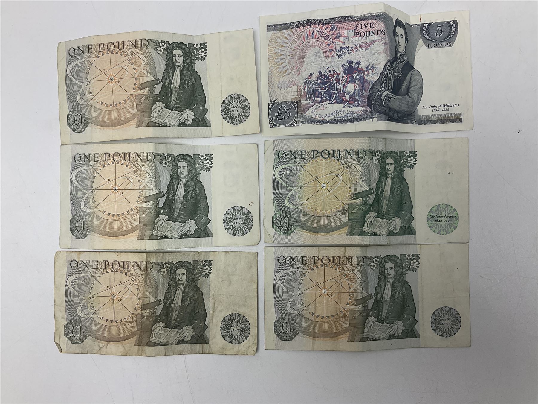 Queen Victoria 1890 crown coin, King George V 1929 half crown, 1922 florin, King George VI 1940 half crown, Bank of England Somerset five pound note 'HW30' and five one pound notes