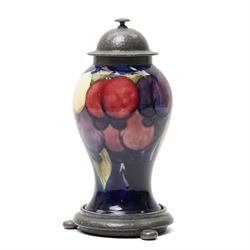 William Moorcroft for Liberty Wisteria pattern baluster vase on a dark blue ground with pl...