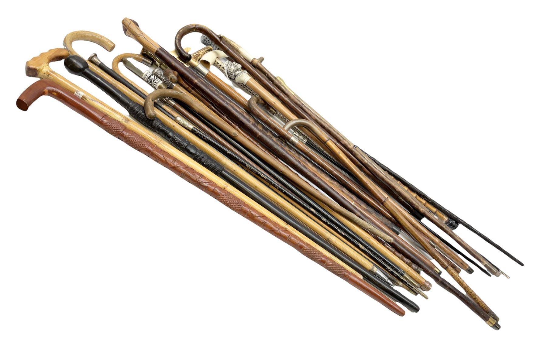 Collection of walking sticks and canes to include 19th/ early 20th ...