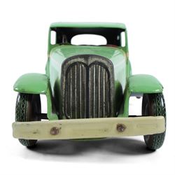 Mettoy large scale tinplate clockwork limousine, circa 1940, with green body and cream lithographed details, red interior with driver, fixed key mechanism, H13cm, L35cm