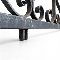 Antique wrought iron sign bracket, with strapwork scroll decoration and arrow form support, in weathered black painted finish