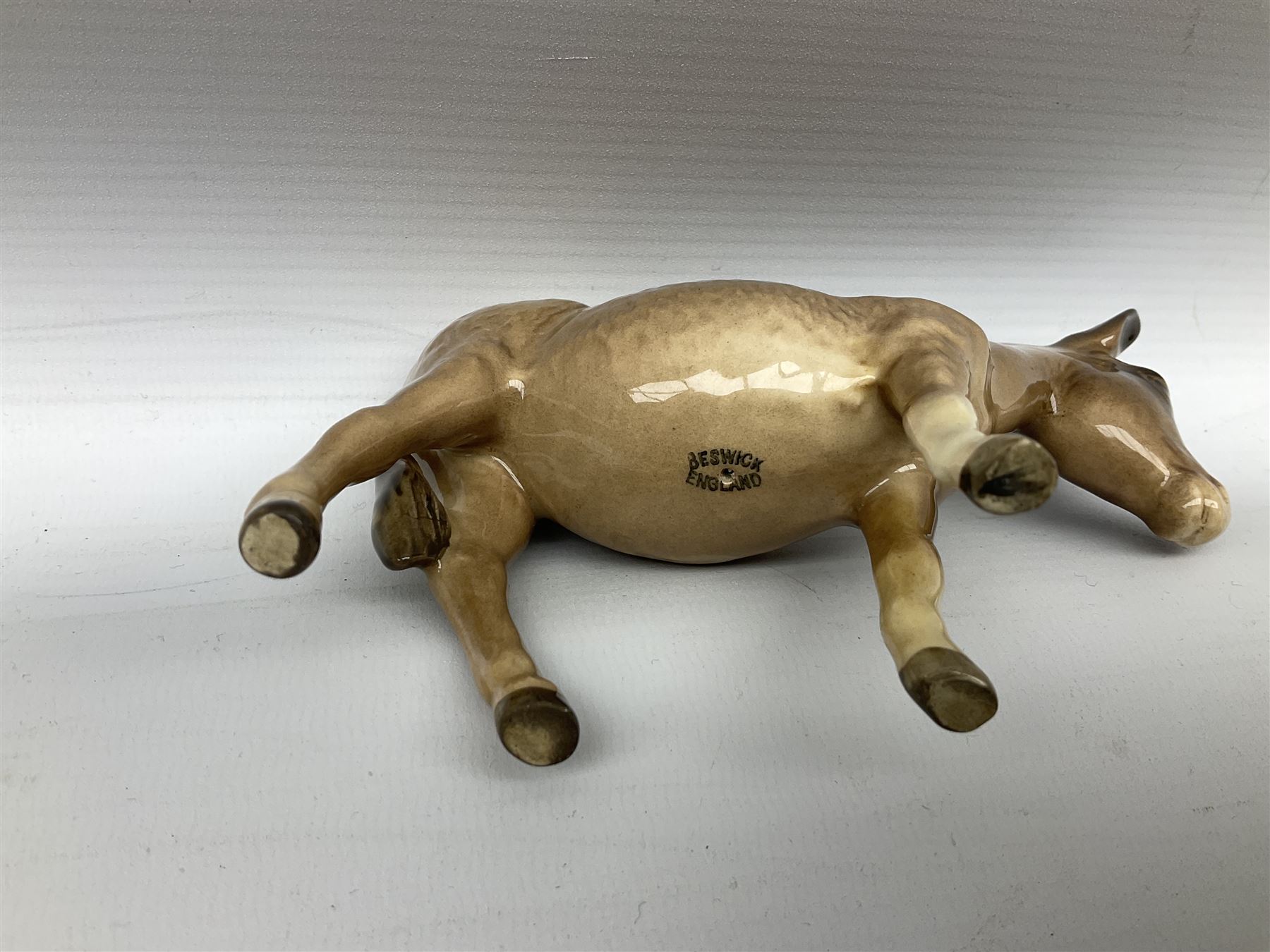 Beswick donkey family to include no.1364b, no.2267a, another donkey and donkey foal (4)