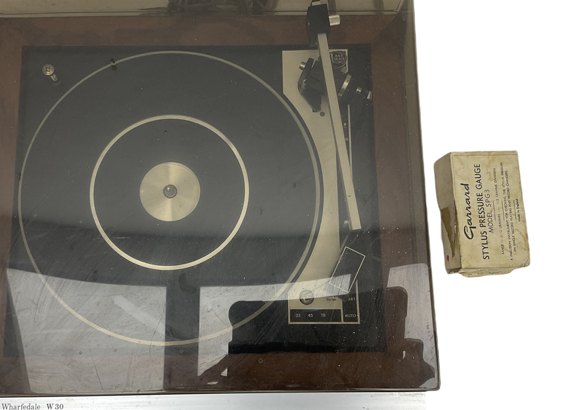 Wharfedale W30 direct drive turntable in teak case and a Garrard stylus pressure gauge model SPG3 - all untested 