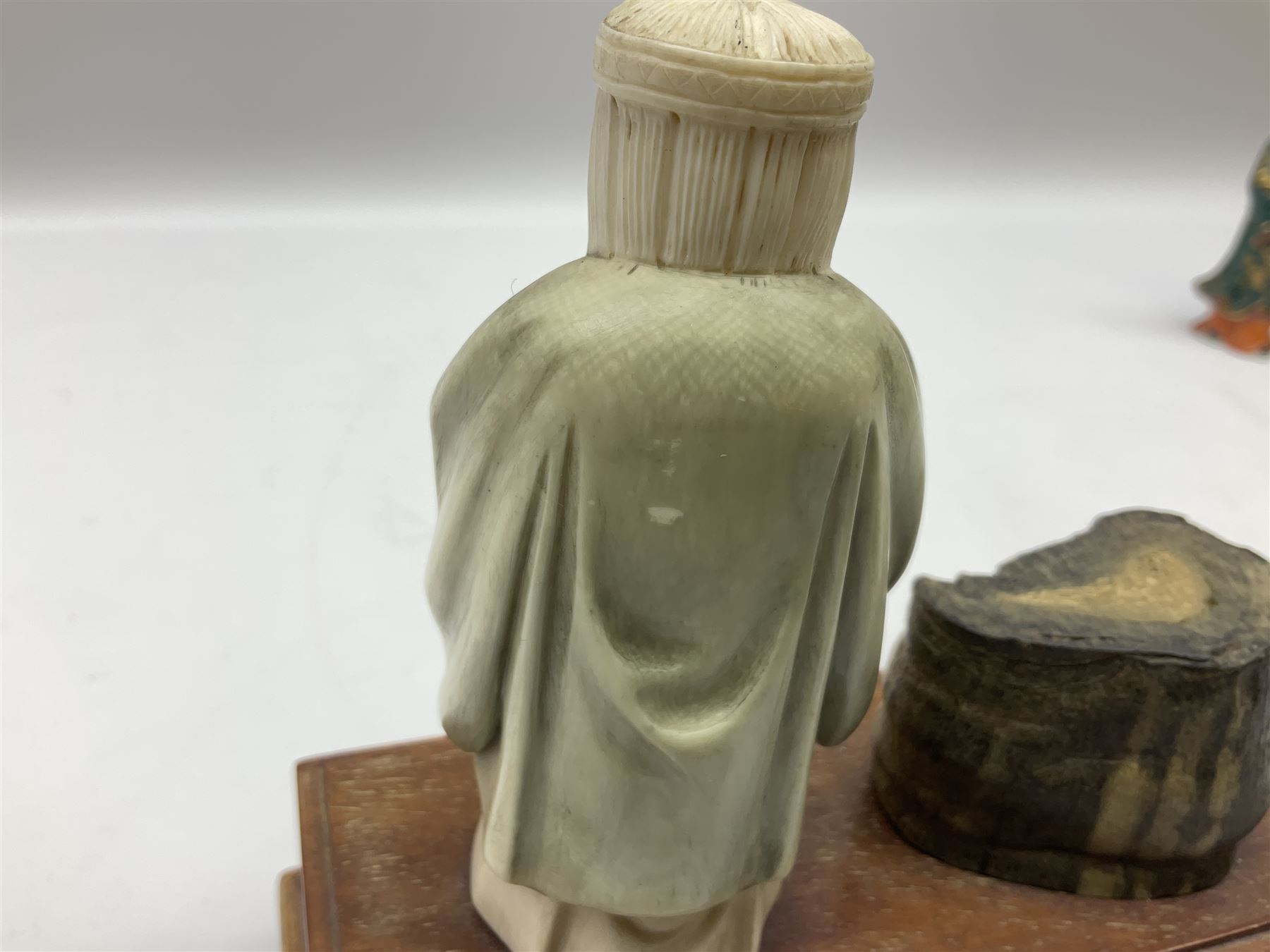 Japanese parquetry puzzle box L12cm; another Japanese puzzle box with marquetry top of Mount Fuji; eleven graduated Chinese figures including immortals; and Chinese figure of a lady standing on a hardwood base next to a horn table (14)