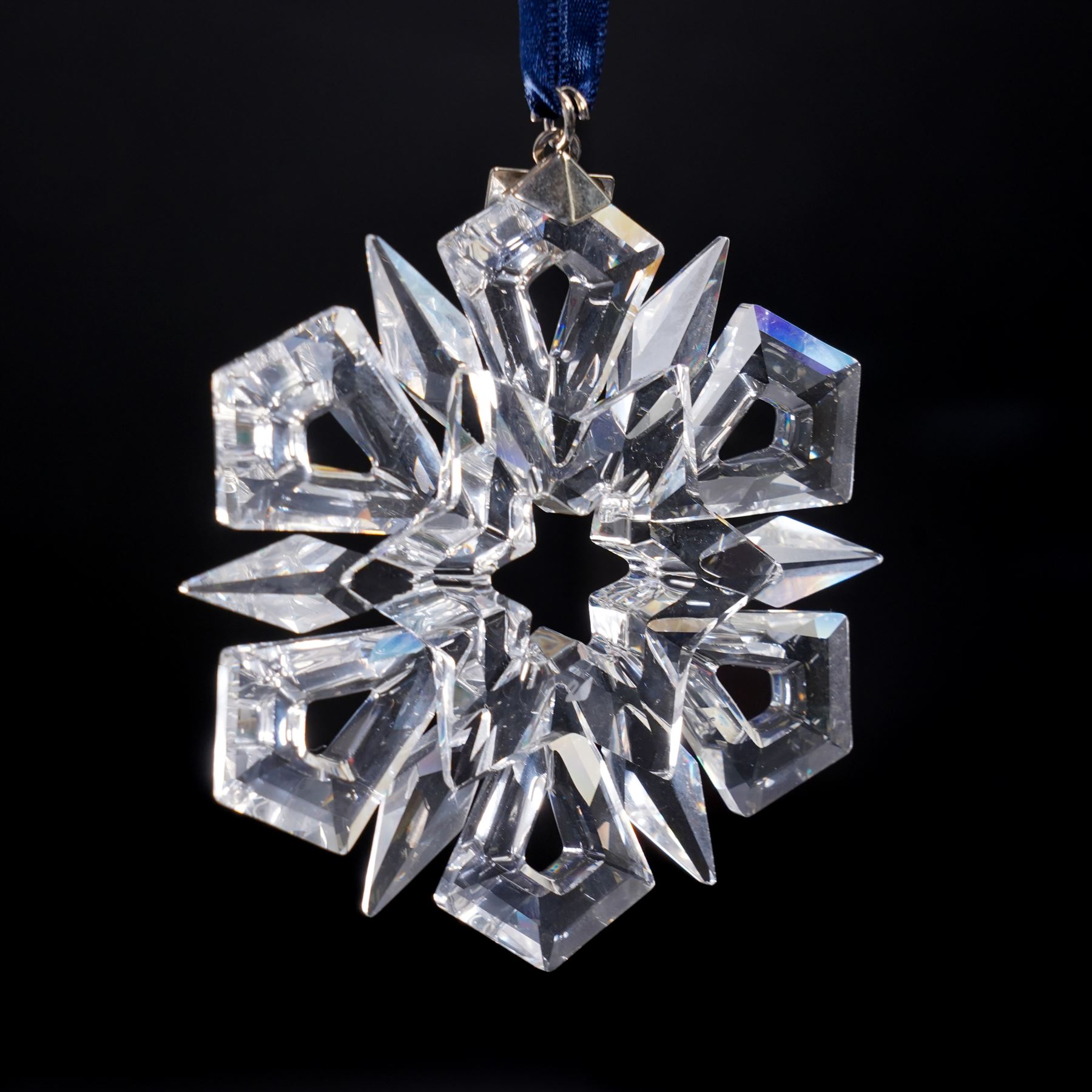 Nine Swarovski crystal snowflake Christmas ornaments, comprising years 1999-2005, 2010 and 2011, some with certificates, boxed (9)